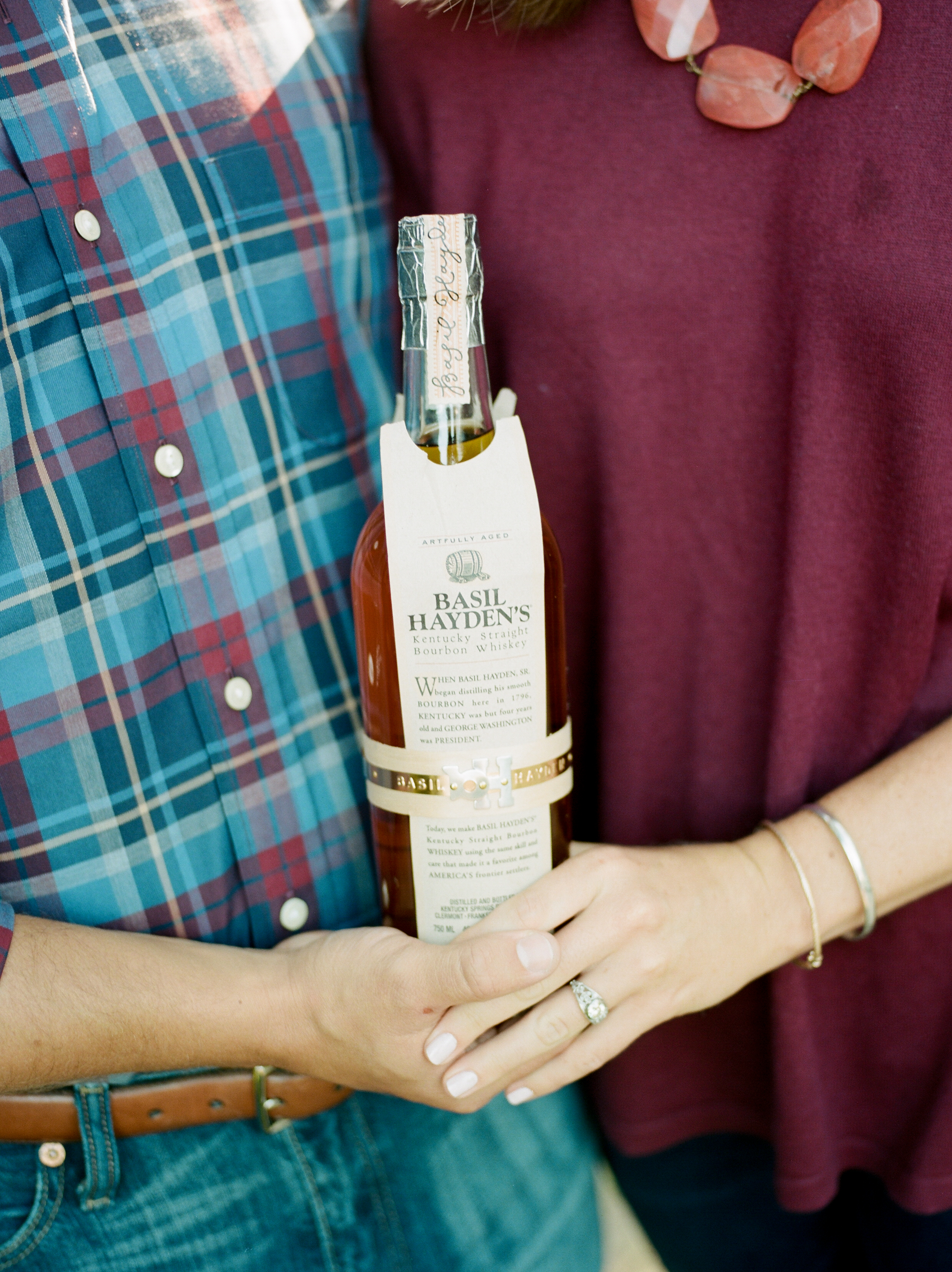 southern wedding traditions couple holding bourbon photo