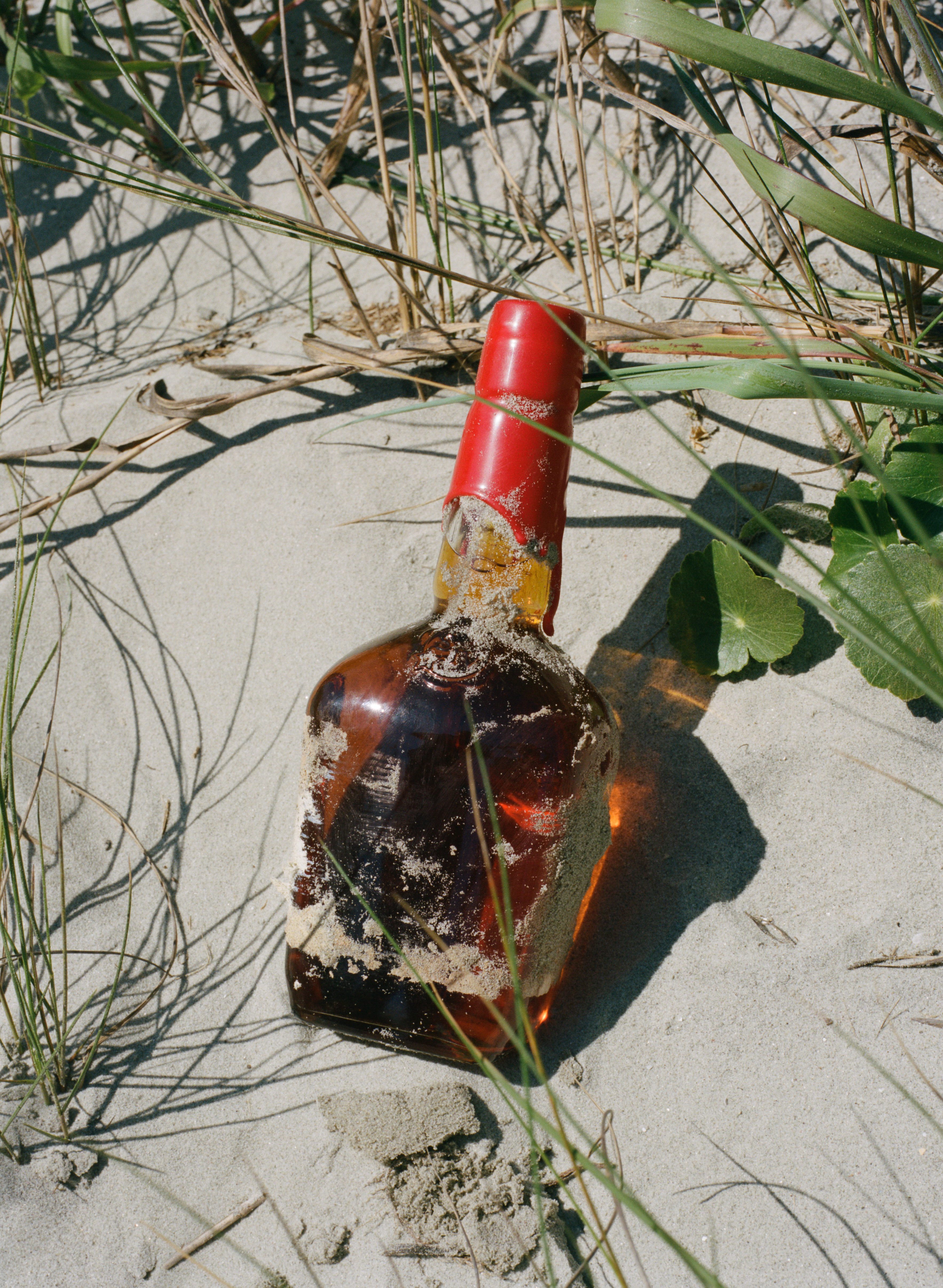 southern wedding traditions bourbon in sand photo