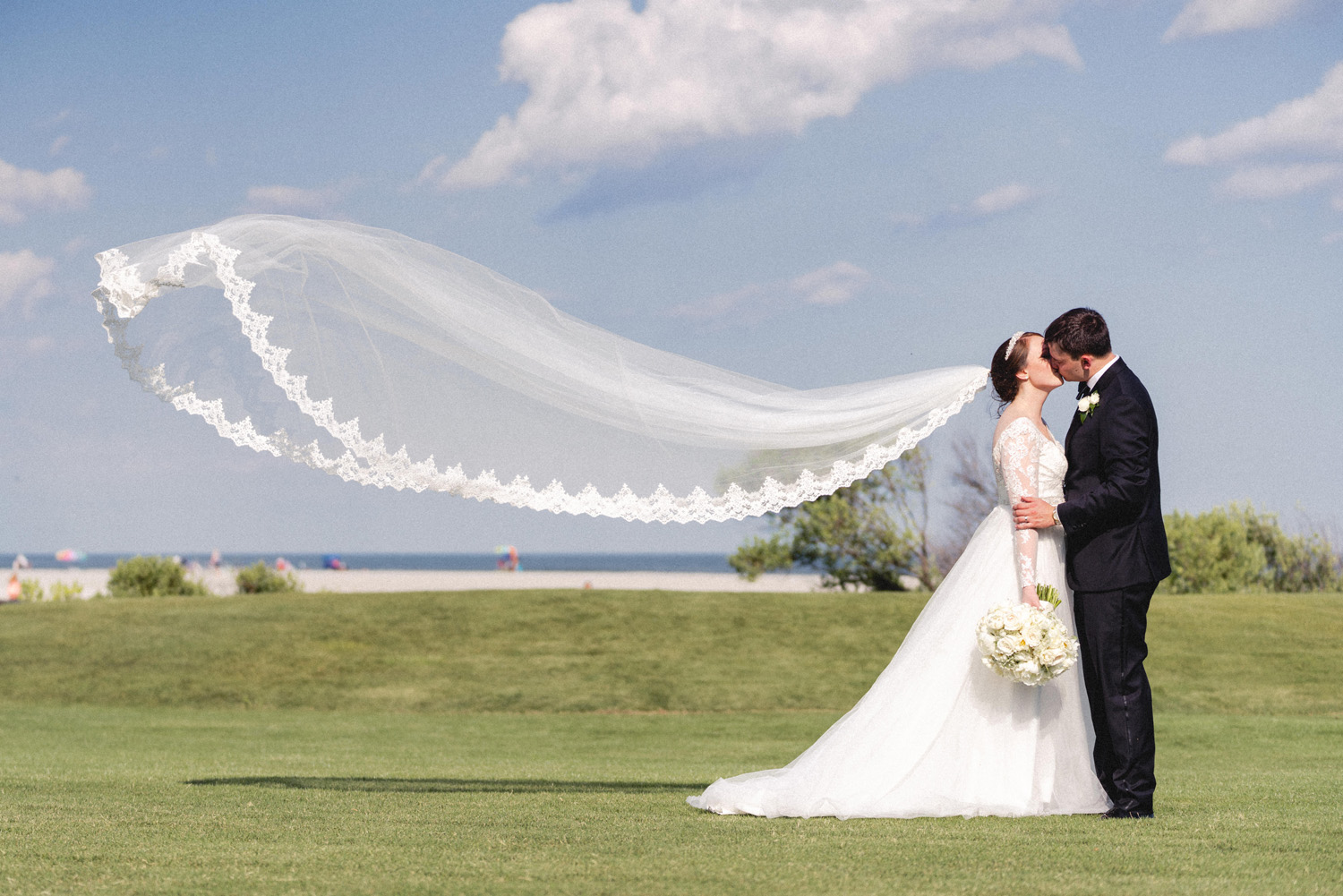 flying veil bride and groom portrait at The Dunes Club by Myrtle Beach wedding photographer gillian claire